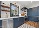 Charming kitchen showcasing dark cabinetry, stainless steel appliances, and an elegant window at 118 W Palm Ln, Phoenix, AZ 85003