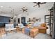 Bright living room with leather couch, modern art, and open to kitchen at 118 W Palm Ln, Phoenix, AZ 85003