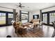 Bright and airy living room with a comfortable leather couch and neutral-toned decor at 118 W Palm Ln, Phoenix, AZ 85003