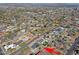 Aerial view of a home with a well-manicured lawn, mature trees, and convenient neighborhood location at 1215 E Cambridge Ave, Phoenix, AZ 85006