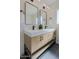 Stylish bathroom featuring a double vanity with quartz countertop, modern fixtures, and sleek mirrors at 1215 E Cambridge Ave, Phoenix, AZ 85006