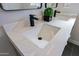 Close up on a bathroom sink featuring a quartz countertop, modern fixtures, and gray tile at 1215 E Cambridge Ave, Phoenix, AZ 85006