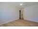 Bright bedroom with wood-look floors, closet, and modern ceiling fan at 1215 E Cambridge Ave, Phoenix, AZ 85006