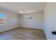 Empty bedroom showcasing hardwood floors, ceiling fan, and bright light at 1215 E Cambridge Ave, Phoenix, AZ 85006