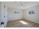 Bright bedroom featuring a ceiling fan and natural light streaming through dual windows at 1215 E Cambridge Ave, Phoenix, AZ 85006