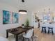 Stylish dining area adjacent to a modern kitchen, featuring a sleek table, comfortable seating, and modern lighting at 1215 E Cambridge Ave, Phoenix, AZ 85006