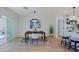 Elegant dining area with a modern light fixture, sleek table setting, and seamless access to the kitchen at 1215 E Cambridge Ave, Phoenix, AZ 85006