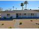 This remodeled single-story home boasts mature landscaping and updated front entrance at 1215 E Cambridge Ave, Phoenix, AZ 85006