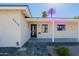 The front entrance features a modern door, tasteful landscaping, and prominent house numbers at 1215 E Cambridge Ave, Phoenix, AZ 85006