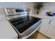 Close-up of a stainless steel range with white cabinets and subway tile backsplash in a modern updated kitchen at 1215 E Cambridge Ave, Phoenix, AZ 85006