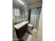 Updated bathroom featuring a modern vanity, tiled shower, and neutral accents at 12236 N Pebble Beach Dr, Sun City, AZ 85351