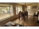 Bright dining area features lots of windows, a ceiling fan, and outdoor access to the patio at 12236 N Pebble Beach Dr, Sun City, AZ 85351