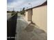 Exterior view of home featuring sidewalk, neutral siding, and desert landscaping with mature cacti at 12236 N Pebble Beach Dr, Sun City, AZ 85351