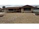 Quaint single-story home featuring neutral stucco, brown trim, and desert rock landscaping at 12236 N Pebble Beach Dr, Sun City, AZ 85351