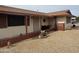 Inviting front porch with decorative accents and a charming desert rock landscape at 12236 N Pebble Beach Dr, Sun City, AZ 85351