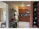 Well-lit kitchen with stylish shelving, tile backsplash, and modern appliances at 12236 N Pebble Beach Dr, Sun City, AZ 85351