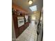 Cozy kitchen features tile floors, wooden cabinets, and a window over the sink that lets in natural light at 12236 N Pebble Beach Dr, Sun City, AZ 85351