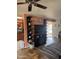 Open concept living room features a ceiling fan and black entertainment center with display shelves at 12236 N Pebble Beach Dr, Sun City, AZ 85351