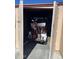 Storage closet with a golf cart inside and golf clubs in the back at 12236 N Pebble Beach Dr, Sun City, AZ 85351