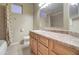 Bathroom featuring a vanity with sink, toilet, and a tub with shower at 12326 N Lang Rd, Florence, AZ 85132