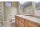 Bright bathroom vanity with wood cabinets, a sink, and a mirror, offering a functional and clean space at 12326 N Lang Rd, Florence, AZ 85132