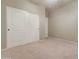 Simple bedroom featuring carpet flooring, a closet, and neutral walls, ready for personalization and rest at 12326 N Lang Rd, Florence, AZ 85132