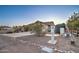 View of home's exterior featuring a gravel yard and private water system at 12326 N Lang Rd, Florence, AZ 85132