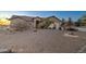 Single-story house with three-car garage surrounded by desert landscaping at 12326 N Lang Rd, Florence, AZ 85132