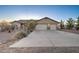 Charming single-story home with a spacious driveway and a two-car garage at 12326 N Lang Rd, Florence, AZ 85132