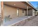 Covered patio with comfortable seating, offering a relaxing outdoor space at 12326 N Lang Rd, Florence, AZ 85132