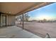 The covered patio has views of the spacious backyard, perfect for relaxing at 12326 N Lang Rd, Florence, AZ 85132