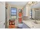 Cozy bathroom featuring tiled floors, a shower, and a vanity with a granite countertop at 13207 N Lakeforest Dr, Sun City, AZ 85351