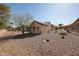 Desert landscaped backyard featuring low-maintenance plants at 15712 W Eucalyptus Ct, Surprise, AZ 85374