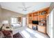 Bright bedroom with a built-in bookshelf, mirrored closet, and natural light at 15712 W Eucalyptus Ct, Surprise, AZ 85374