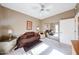 Comfortable bedroom featuring mirrored closets and soft natural lighting at 15712 W Eucalyptus Ct, Surprise, AZ 85374