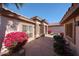 Inviting front courtyard featuring desert landscaping and a stone-accented facade at 15712 W Eucalyptus Ct, Surprise, AZ 85374