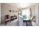 Elegant dining room featuring carpeted floors, chair rail molding and a chandelier at 15712 W Eucalyptus Ct, Surprise, AZ 85374