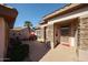 Inviting front porch featuring stone accents and a security door, surrounded by desert landscaping at 15712 W Eucalyptus Ct, Surprise, AZ 85374