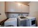 Functional laundry room with a sink, washer, and dryer at 15712 W Eucalyptus Ct, Surprise, AZ 85374