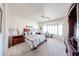 Bright main bedroom featuring a bay window with shutters, and a serene, neutral color palette at 15712 W Eucalyptus Ct, Surprise, AZ 85374