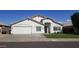 Charming single-story home featuring a well-manicured lawn, attached two car garage, and neutral colored stucco facade at 15971 N 91St Dr, Peoria, AZ 85382