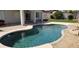 The sparkling pool is surrounded by patio and landscaping at 15971 N 91St Dr, Peoria, AZ 85382