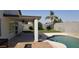 The sparkling pool is adjacent to a covered porch and hardscape at 15971 N 91St Dr, Peoria, AZ 85382