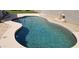 The sparkling pool has desert landscaping and hardscape at 15971 N 91St Dr, Peoria, AZ 85382