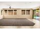 Spacious living room featuring a ceiling fan and multiple windows for natural light at 16074 W Cortez St, Surprise, AZ 85379