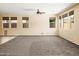 Open living room with neutral paint, carpet and tile flooring at 16074 W Cortez St, Surprise, AZ 85379