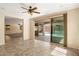 Living room with sliding glass doors that view the swimming pool outside at 16074 W Cortez St, Surprise, AZ 85379