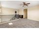 Upstairs loft featuring neutral carpet and a built in storage space at 16074 W Cortez St, Surprise, AZ 85379