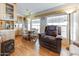 Dining area features wood cabinets, breakfast nook, and comfortable armchair at 17200 W Bell Rd # 845, Surprise, AZ 85374