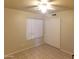 Bright bedroom with a ceiling fan, tile flooring, and closet space at 1734 E Commonwealth Cir, Chandler, AZ 85225